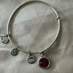 Alex and Ani adjustable bracelet with January birthstone. Red garnet. Silvertone